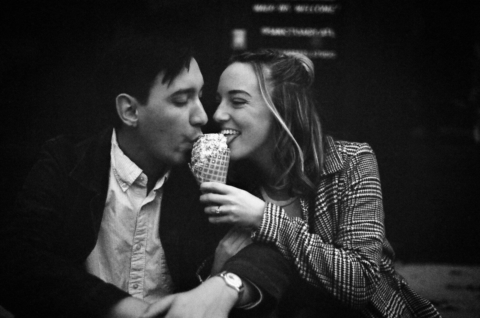 Couple sharing an ice cream cone